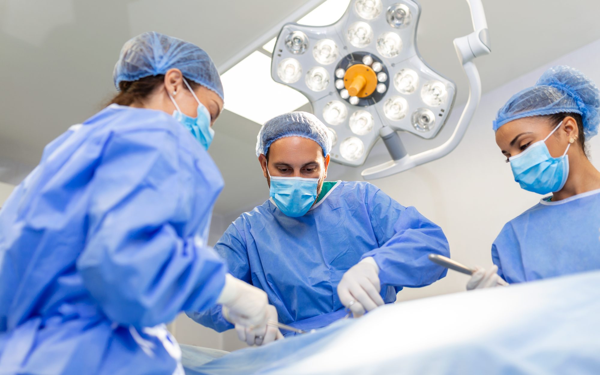 A surgical team at work in an operating theatre.